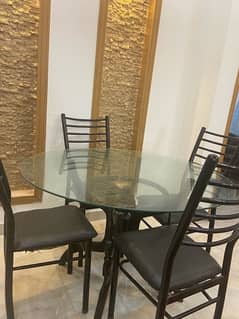 4 chair wooden dining table with glass top with 4 iron chairs