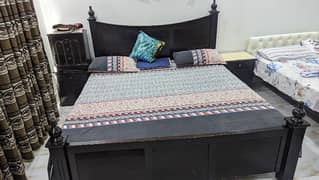 King size Wooden bed with mattress.