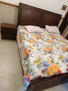 wooden bed with two side tables for sale