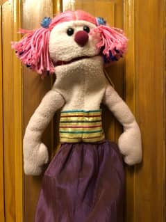 hand made girl puppet with pink hair and skirt