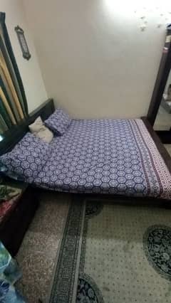 I am selling a wooden bed set.