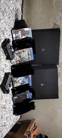 Two  PS4 pro 1 Tb buy one get one free , 2 controllers and 4 games CDs