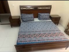 bed with two side tables