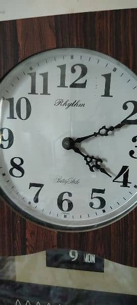 Antique Rhythm vintage wall clock day and date strike pendulum 1
