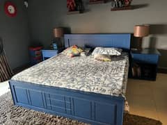 Blue Queen size bed with side tables