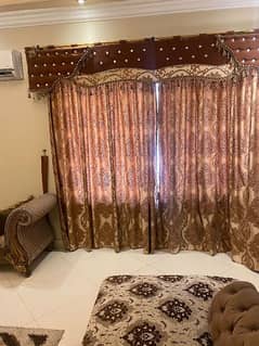 sofa set + curtains + table + rug