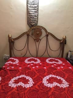 wrought iron bed with 2 side tables with drawers