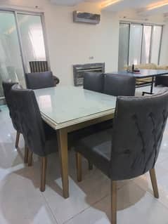 Like new Wood Dining Table with glass top and 6 chairs