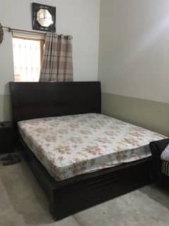 Bed with spring mattress and 1 side table