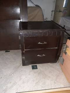 wooden bed set with side drawers. .