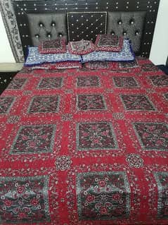 king size wooden double bed without mattress and with 02 side tables.
