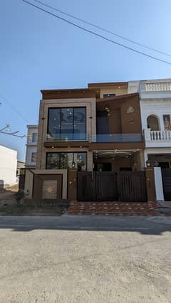 5 Marla half triple story brand new very beautiful hot location house for sale in Park view City Lahore