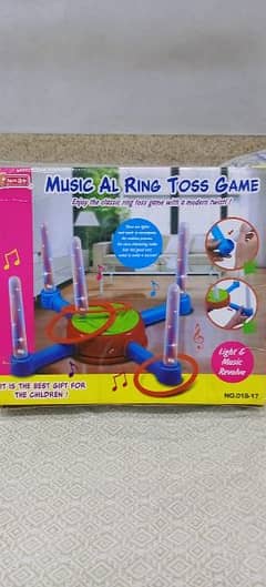 Musical rotating ring toss game