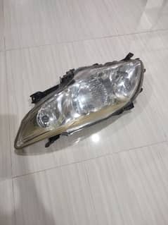 Corolla gli/xli headlight genuine condition 10/9