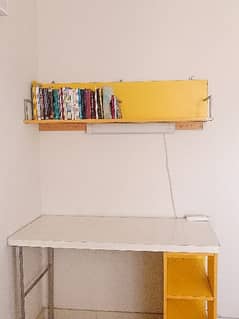 Study table with wall mounted shelf