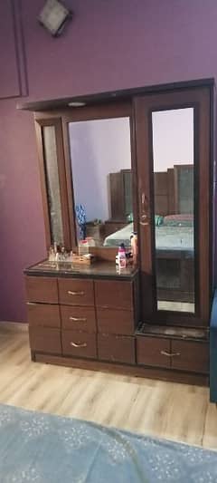 Double bed with mattress,side tables and dressing table.