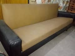 3 seater sofa covered with leather covering