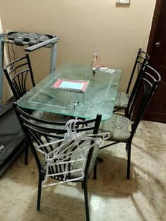 dining table for sale in good condition with four chairs