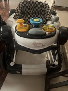 Tinnies car style walker & rocker in excellent condition is for sale