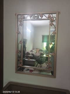 Iron console with mirror.