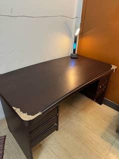 office table dark brown wooden. Dimensions are 4’9 by 2’8 (in feet)