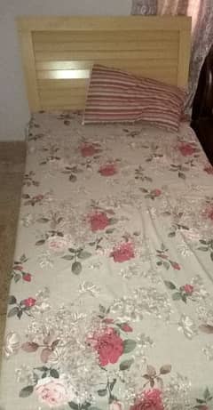 wooden single bed with mattres