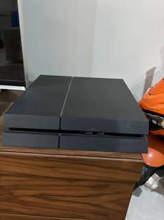 PS4 with VR headset and two controllers