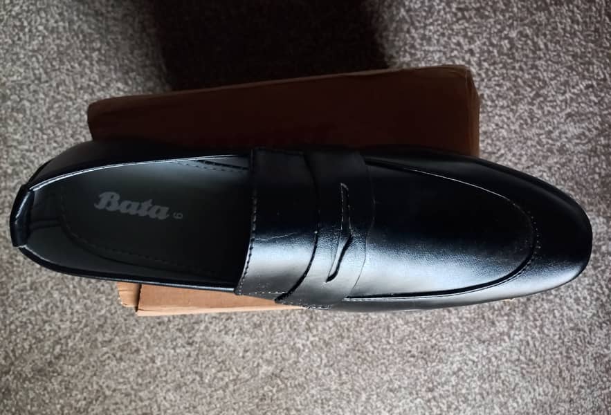 Brand new black colour shoes from Bata company with original box. Made 2