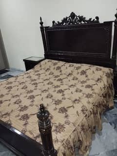 King size bed with side tables and dressing table.