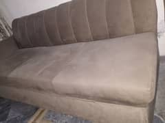 L shape sofa in brown color