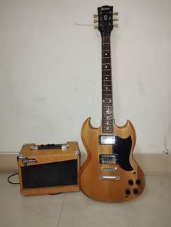 Brown SG electric guitar with amp