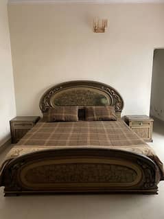 King size wooden bed with side tables and dressing table