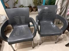 two used chairs plastic