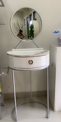 Modern vanity dressing table with stool and mirror.