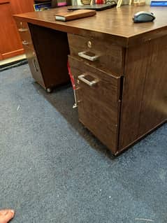 Large office table with 4 drawers and 2 cabinets.