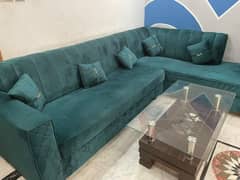 L shap sofa with table