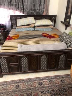 wooden and mirror traditional bed