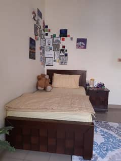 single bed with 2 side tables,