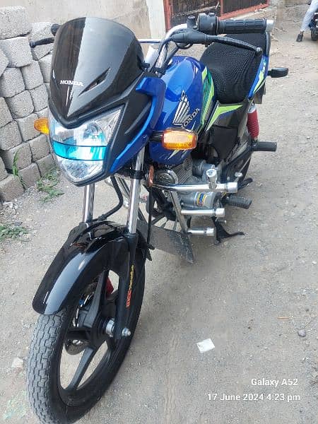 Honda cb 125f 2023 blue colour Islamabad number ten by ten life time 1