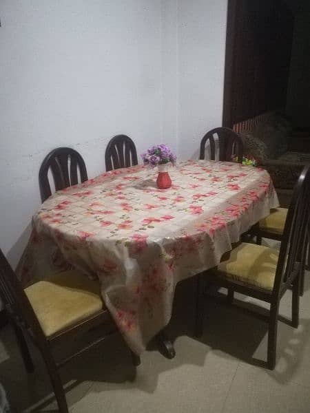 Dinning table and new poshish chairs 0