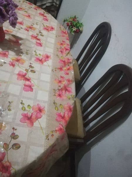 Dinning table and new poshish chairs 1