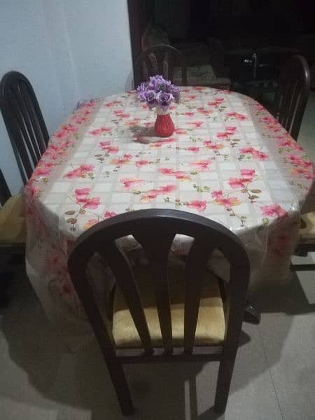 Dinning table and new poshish chairs 2