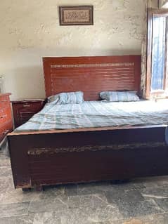 double bed with side table and dressing