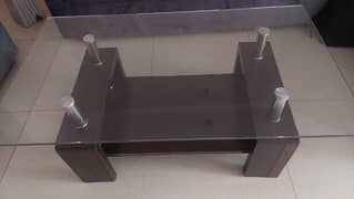 Glass centre table for sale.