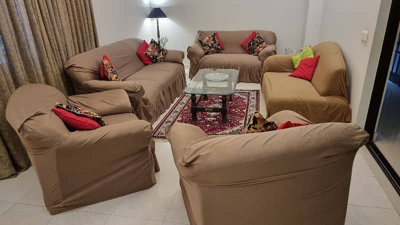 Slightly used 7 seater sofa with three tables. 1