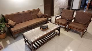 5 seater wooden sofa with tables in good condition.
