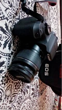 1300d canon with zoom and portrait lens