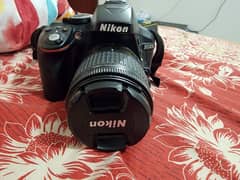 Nikkon D5300 with kit lens and nikkor 35mm