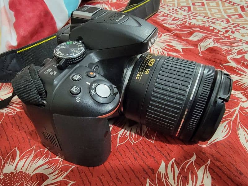 Nikkon D5300 with kit lens and nikkor 35mm 2