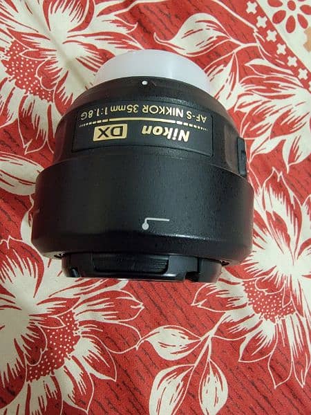Nikkon D5300 with kit lens and nikkor 35mm 5